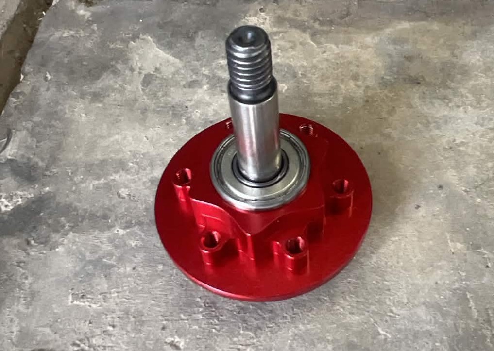 Aluminum 6061 hub with splines on either side to key the 3DP gear teeth or the weapon blade. The hub was held together by 6x 8-32 screws.