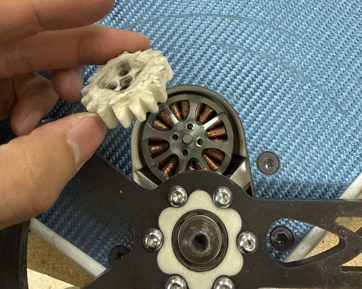 Sheared motor screws, later fixed by adjusting the 3D print to include a keying interface into the top of the motor.